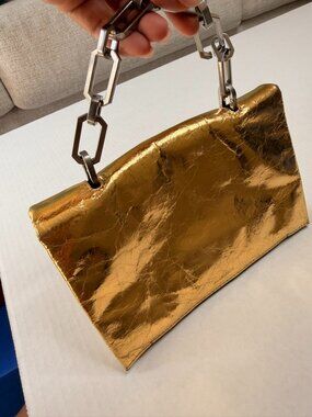 This is an AllSaints Yua Leather Removable Chain Clutch Bag in Warm Gold